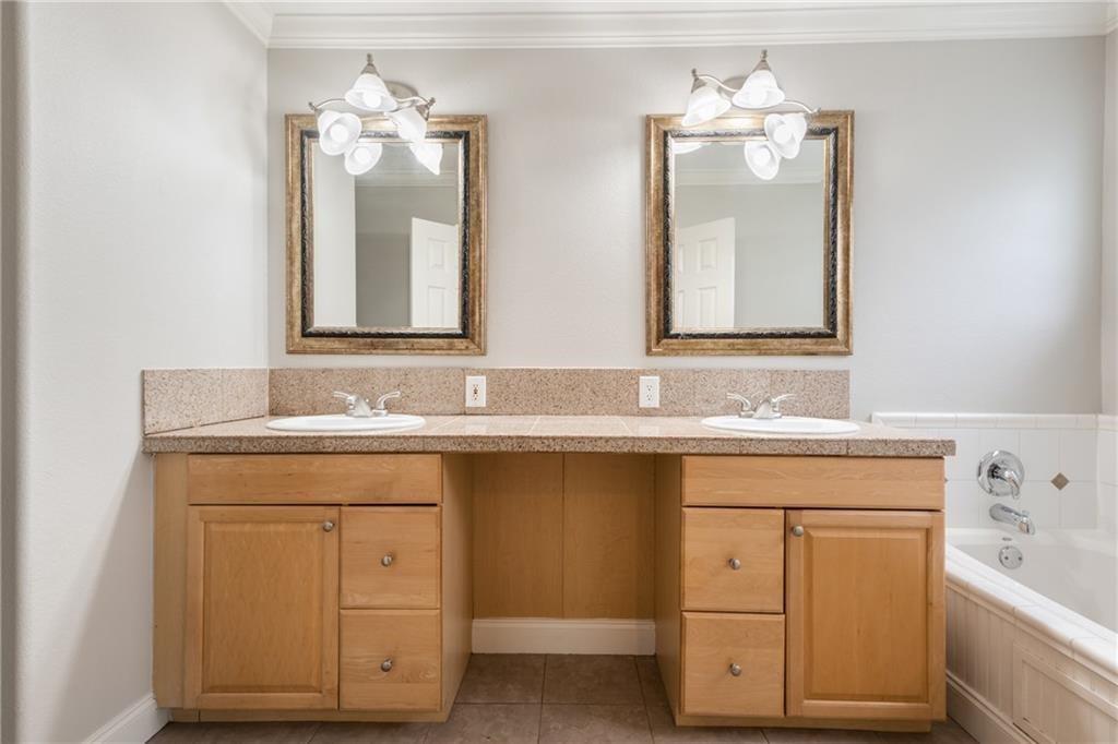 714 East 45th Street Austin, TX 78751 - Photo 10 of 26 a bathroom with a sink double vanity and a mirror