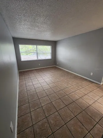a view of an empty room and windows