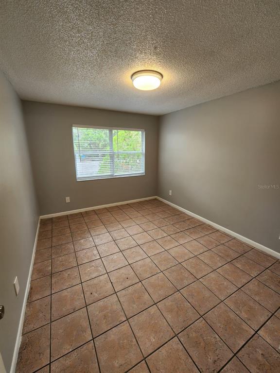 101 North Fernwood Avenue, Unit 6 Clearwater, FL 33765 - Photo 7 of 12 a view of an empty room and window