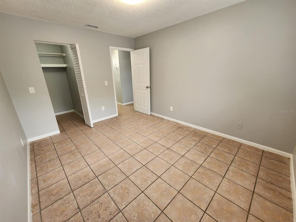 101 North Fernwood Avenue, Unit 6 Clearwater, FL 33765 - Photo 8 of 12 a view of an empty room and wooden floor