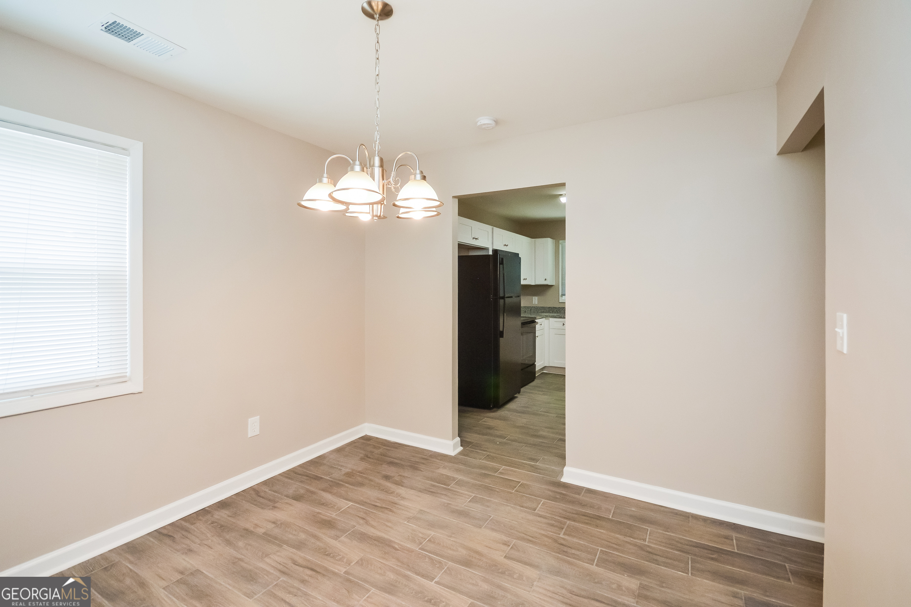 1534 Flicker Road Hampton, GA 30228 - Photo 11 of 16 a view of a chandelier in big room and chandelier