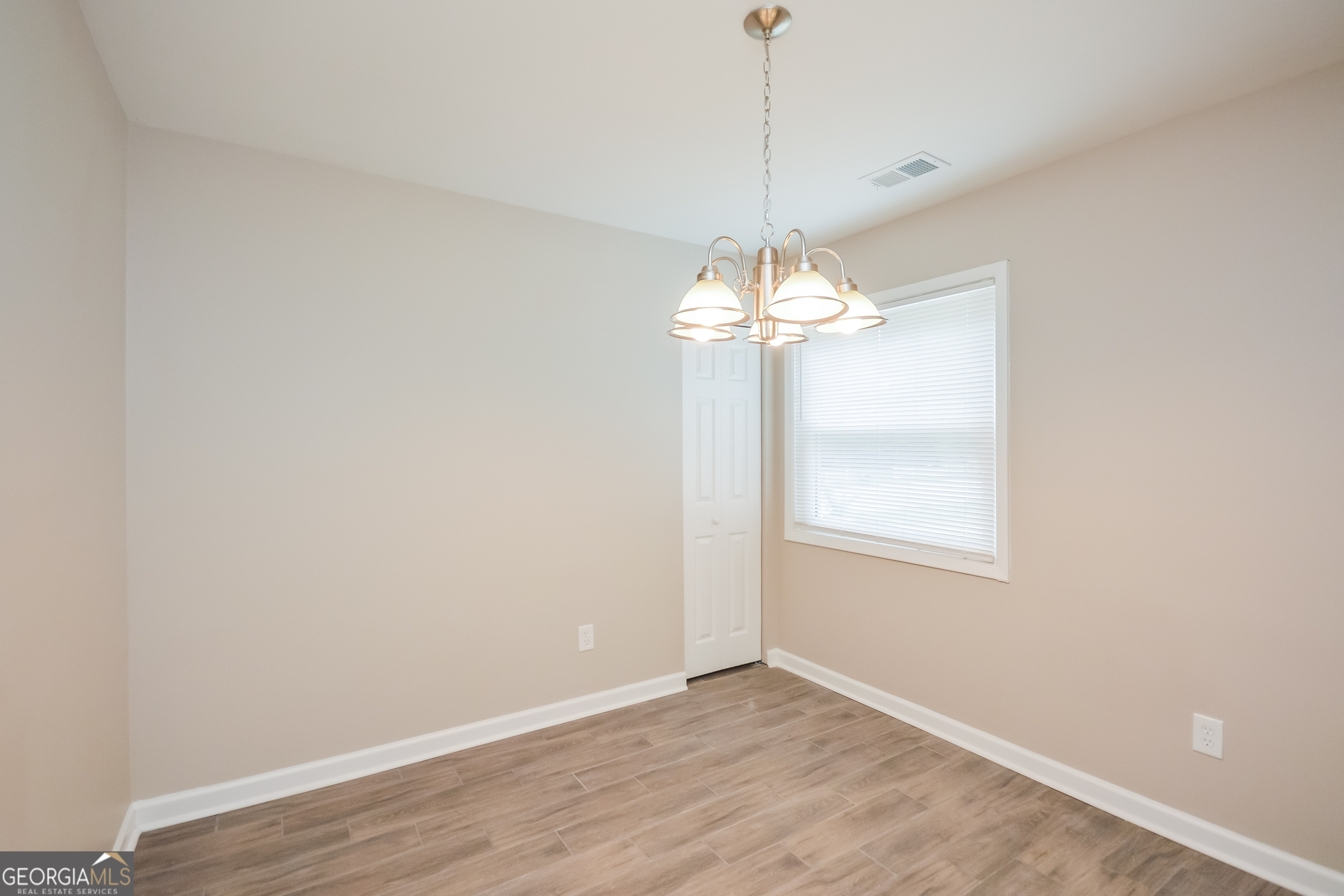 1534 Flicker Road Hampton, GA 30228 - Photo 7 of 16 a view of an empty room with a window