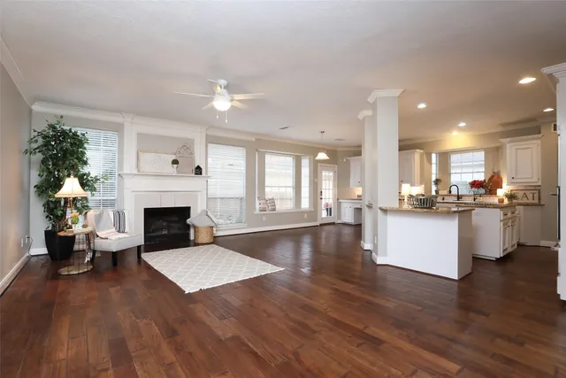 a living room with fireplace furniture and a fireplace