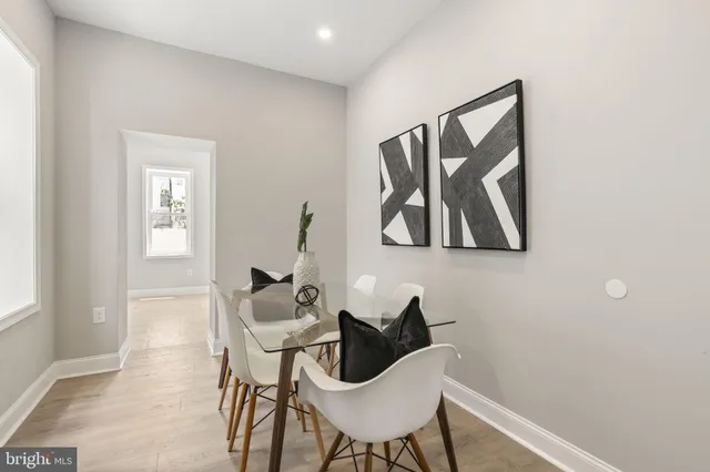 a view of a livingroom with furniture and wooden floor