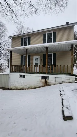 front view of a house with a road