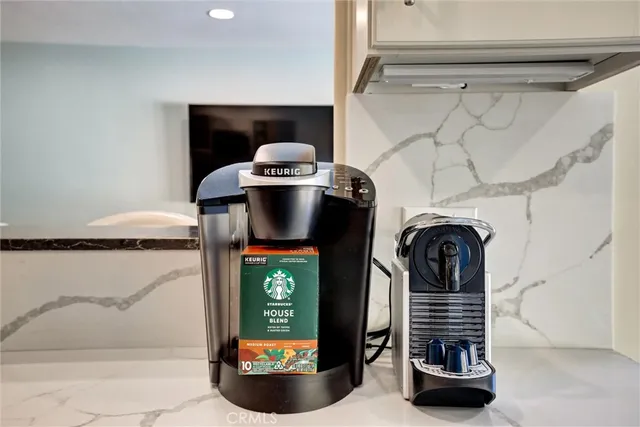 a living room with couches and a flat screen tv