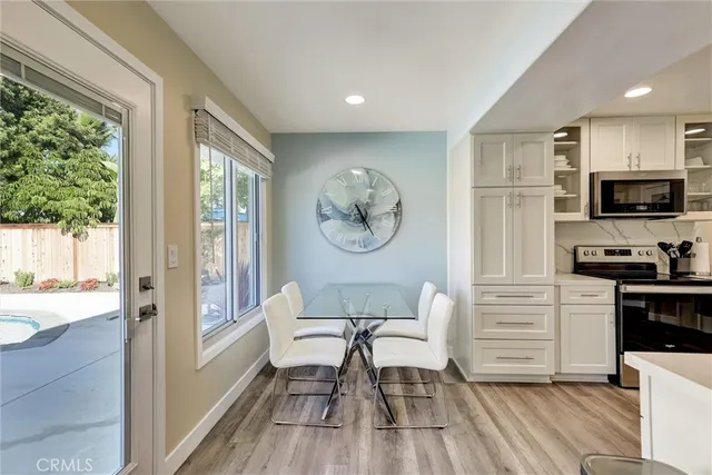 a living room with furniture and a glass door shower