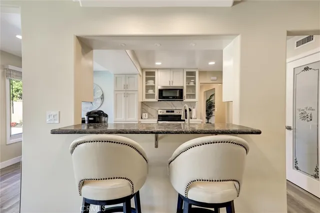 a bedroom with a large bed and ceiling fan