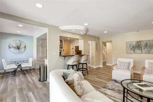 a view of entryway with wooden floor and stairs