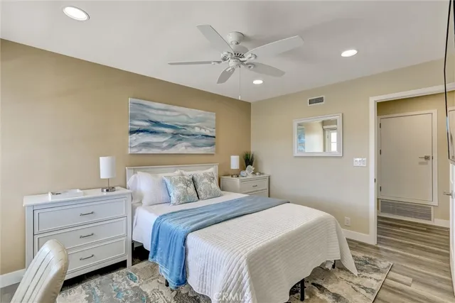 a view of a dinning table and chairs in back yard of a house
