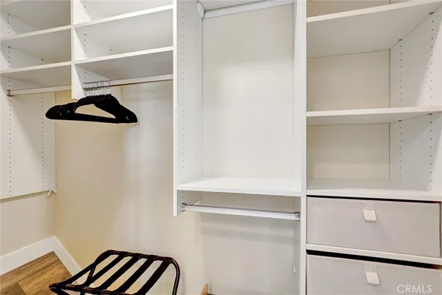 a view of bathroom with a potted plant and a window