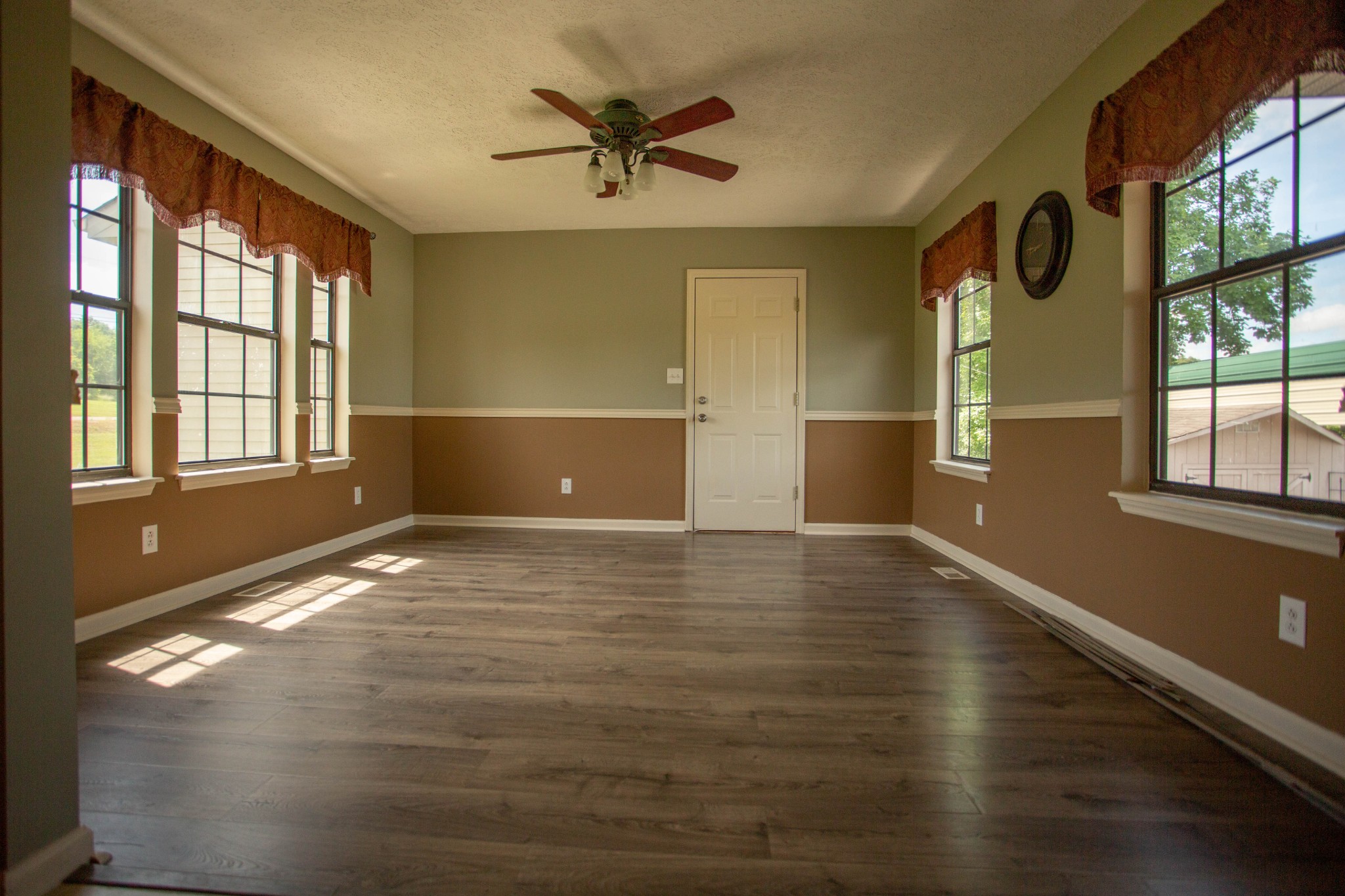 794 Chicken Road Lebanon, TN 37090 - Photo 11 of 25 a view of an empty room with a window and wooden floor