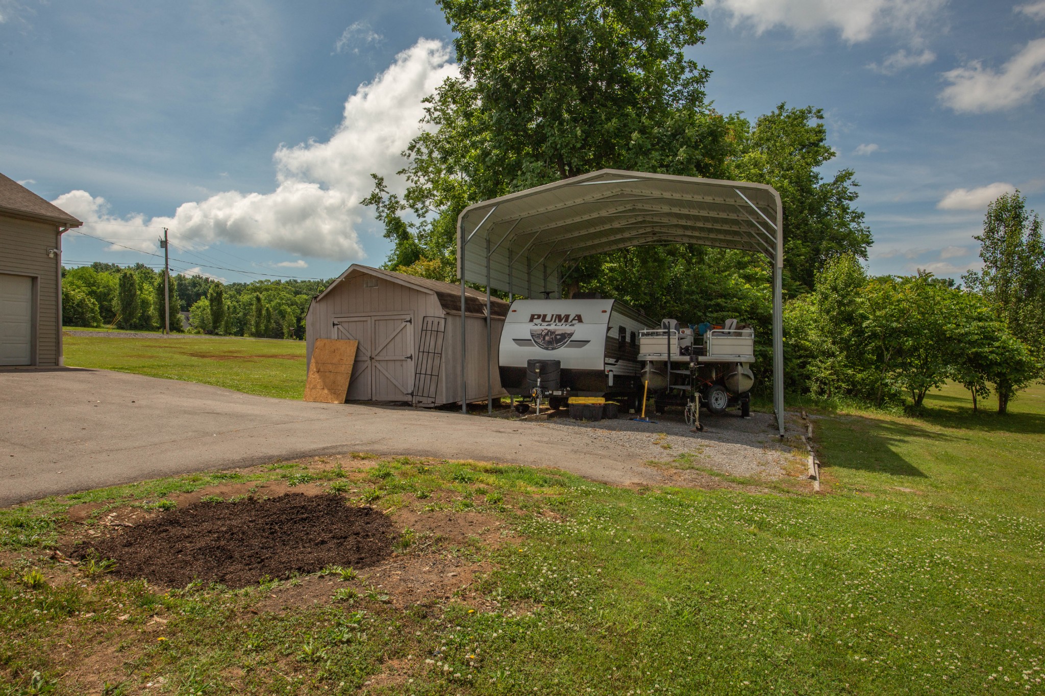 794 Chicken Road Lebanon, TN 37090 - Photo 23 of 25 a backyard of a house with barbeque oven table and chairs