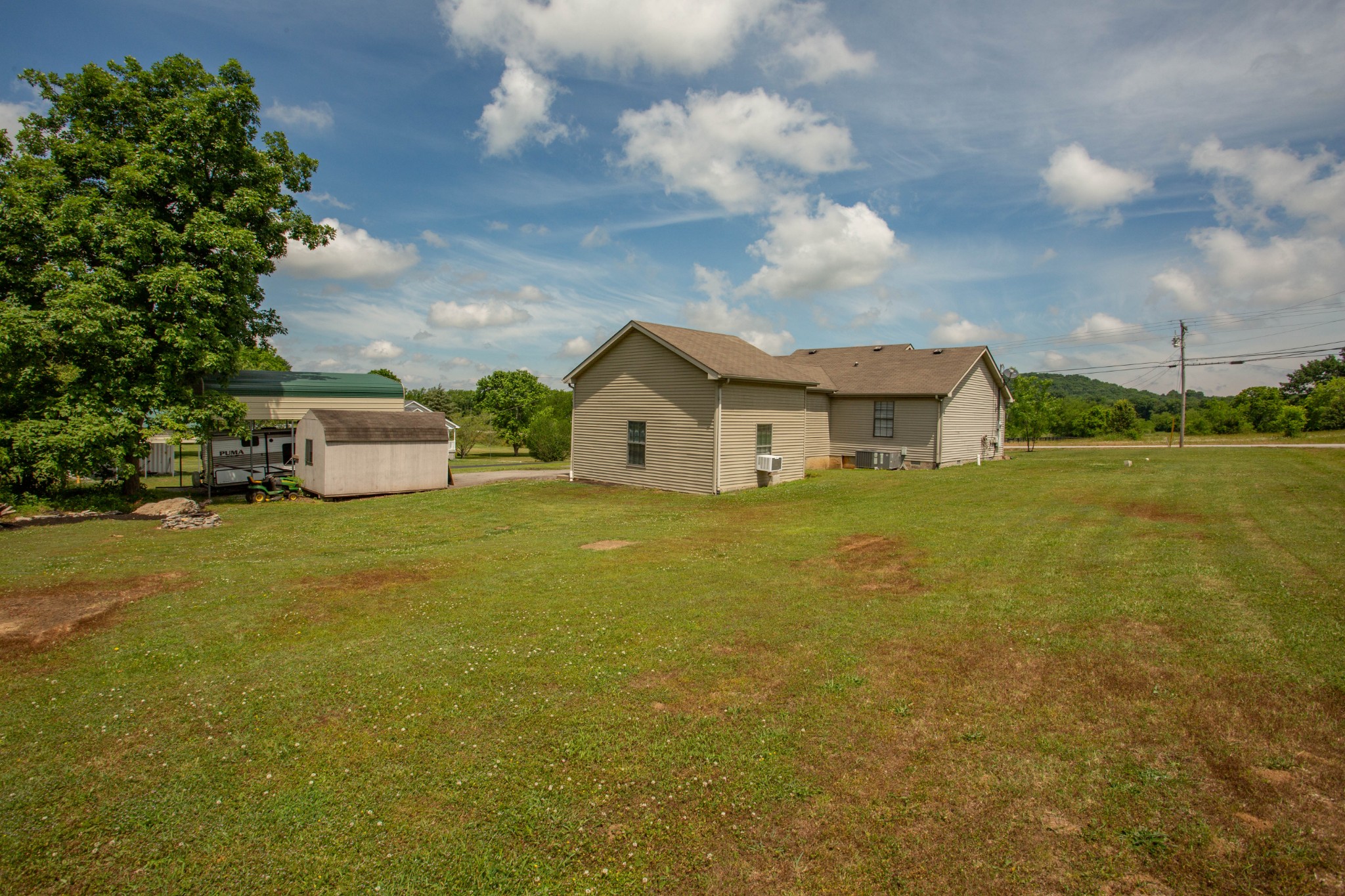 794 Chicken Road Lebanon, TN 37090 - Photo 25 of 25 a view of a house with a yard and garage