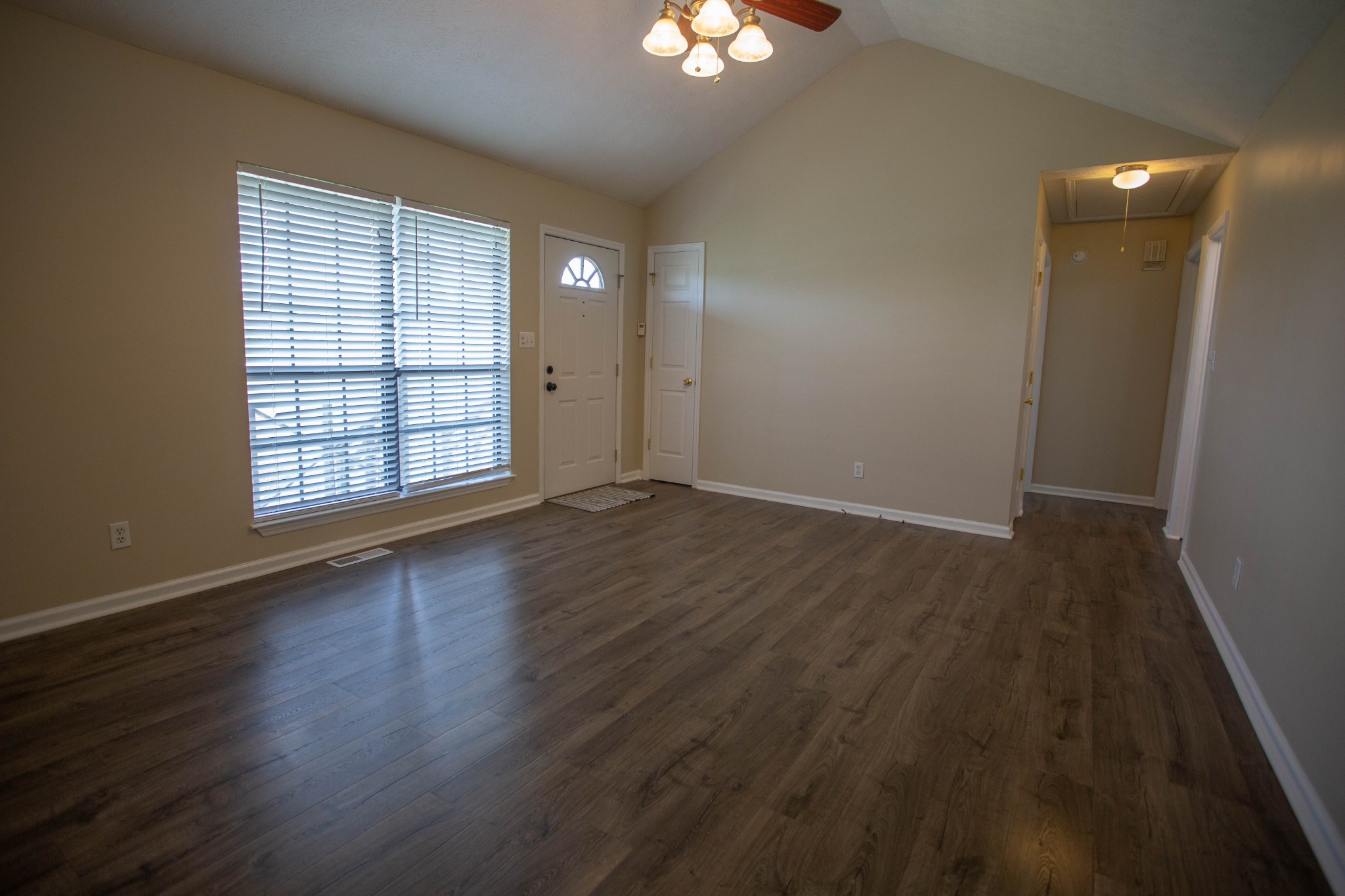 794 Chicken Road Lebanon, TN 37090 - Photo 5 of 25 an empty room with wooden floor and windows
