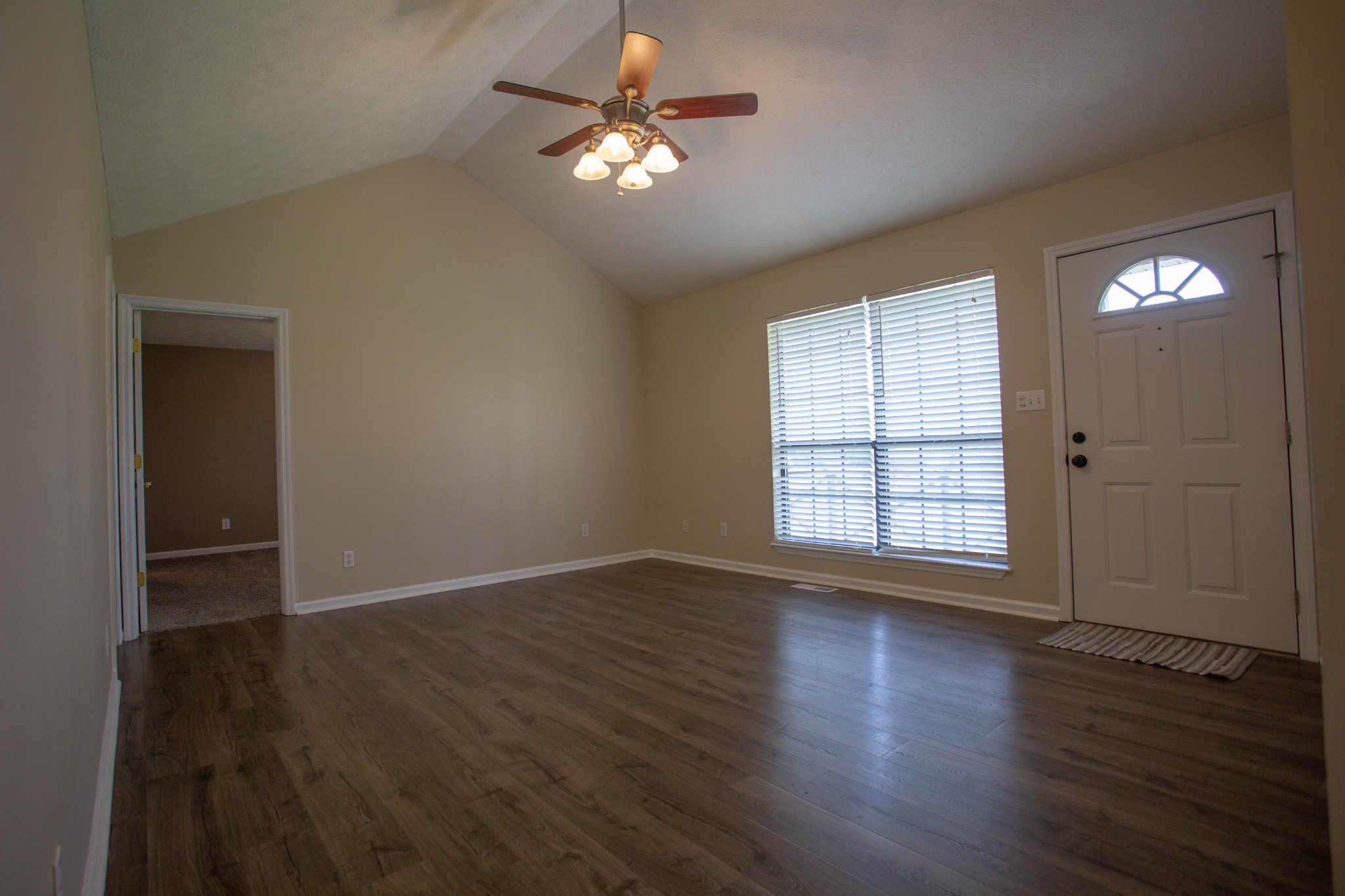 794 Chicken Road Lebanon, TN 37090 - Photo 6 of 25 an empty room with wooden floor and windows