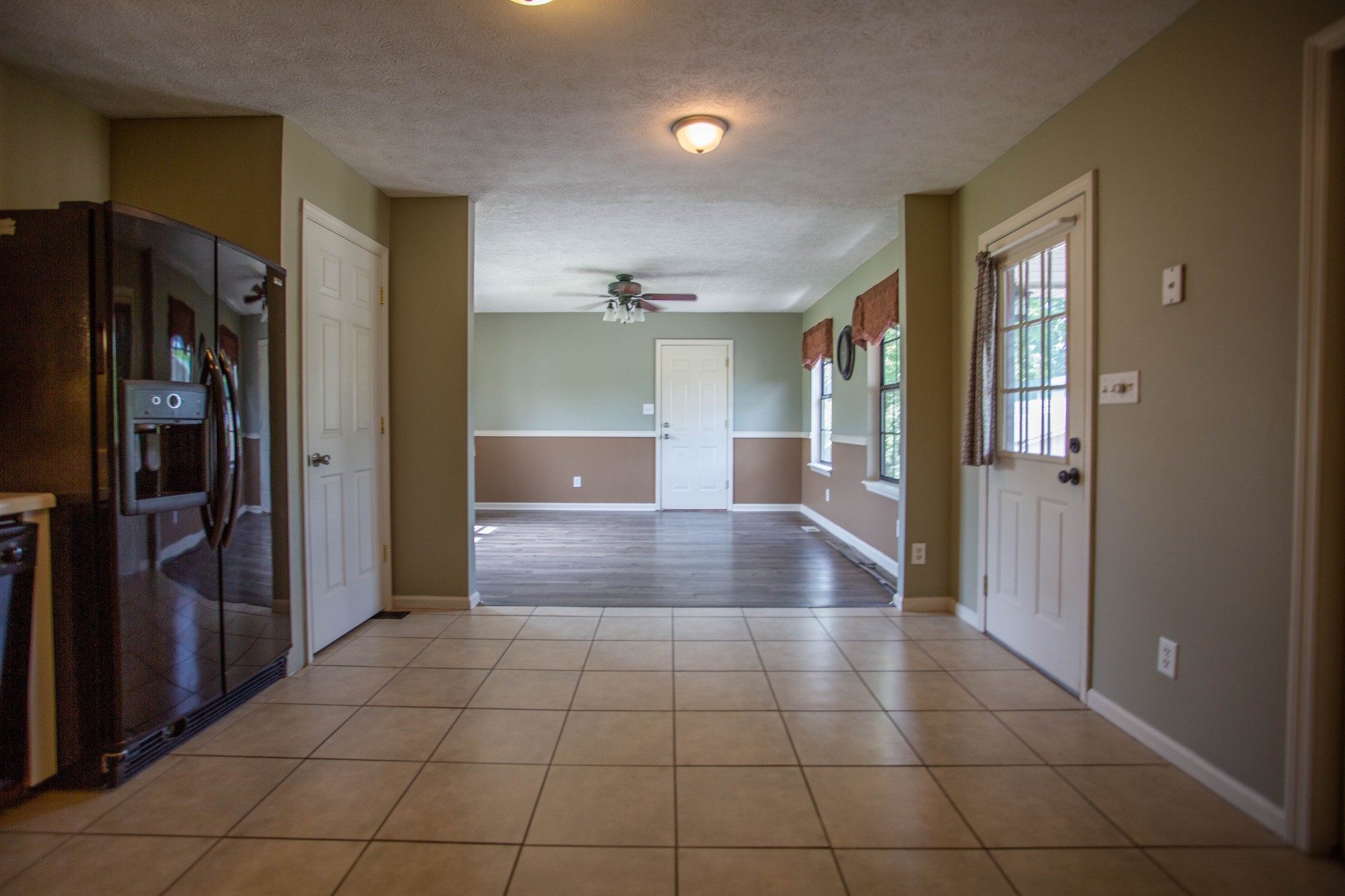 794 Chicken Road Lebanon, TN 37090 - Photo 8 of 25 a view of a hallway with wooden shelves