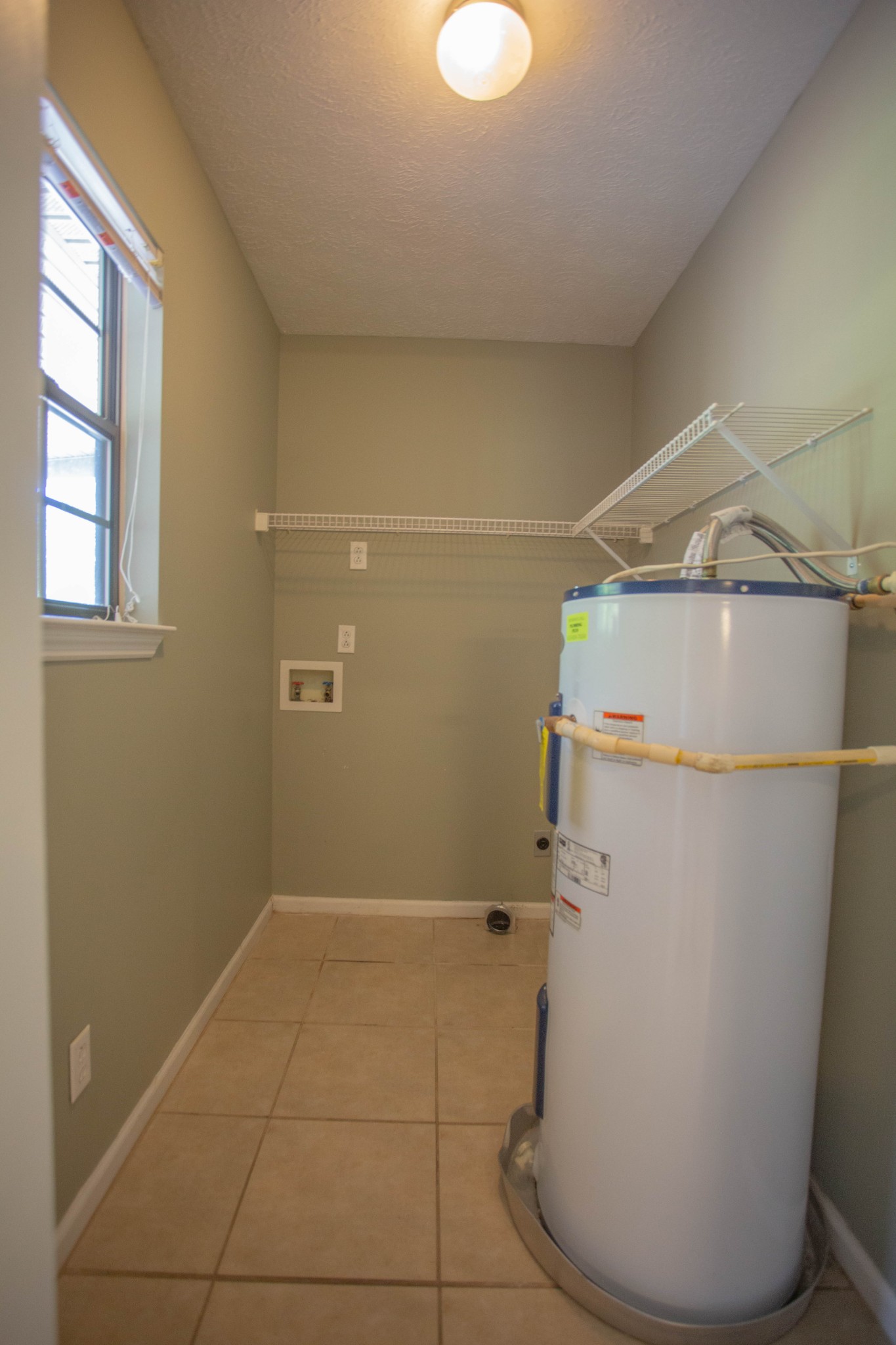 794 Chicken Road Lebanon, TN 37090 - Photo 10 of 25 a view of a storage & utility room with a washer dryer