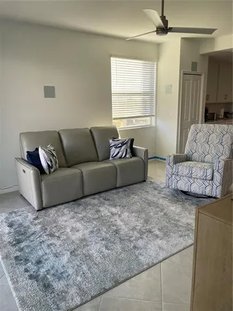 a living room with couches and a couch