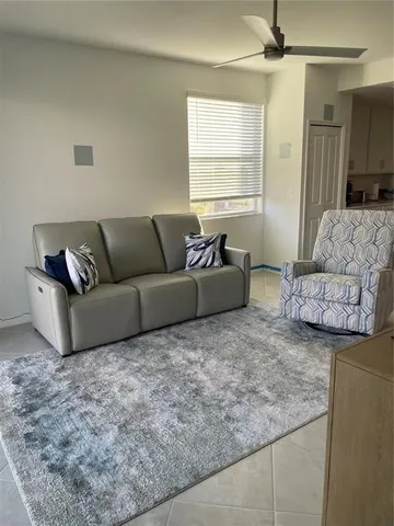 a living room with couches and a couch