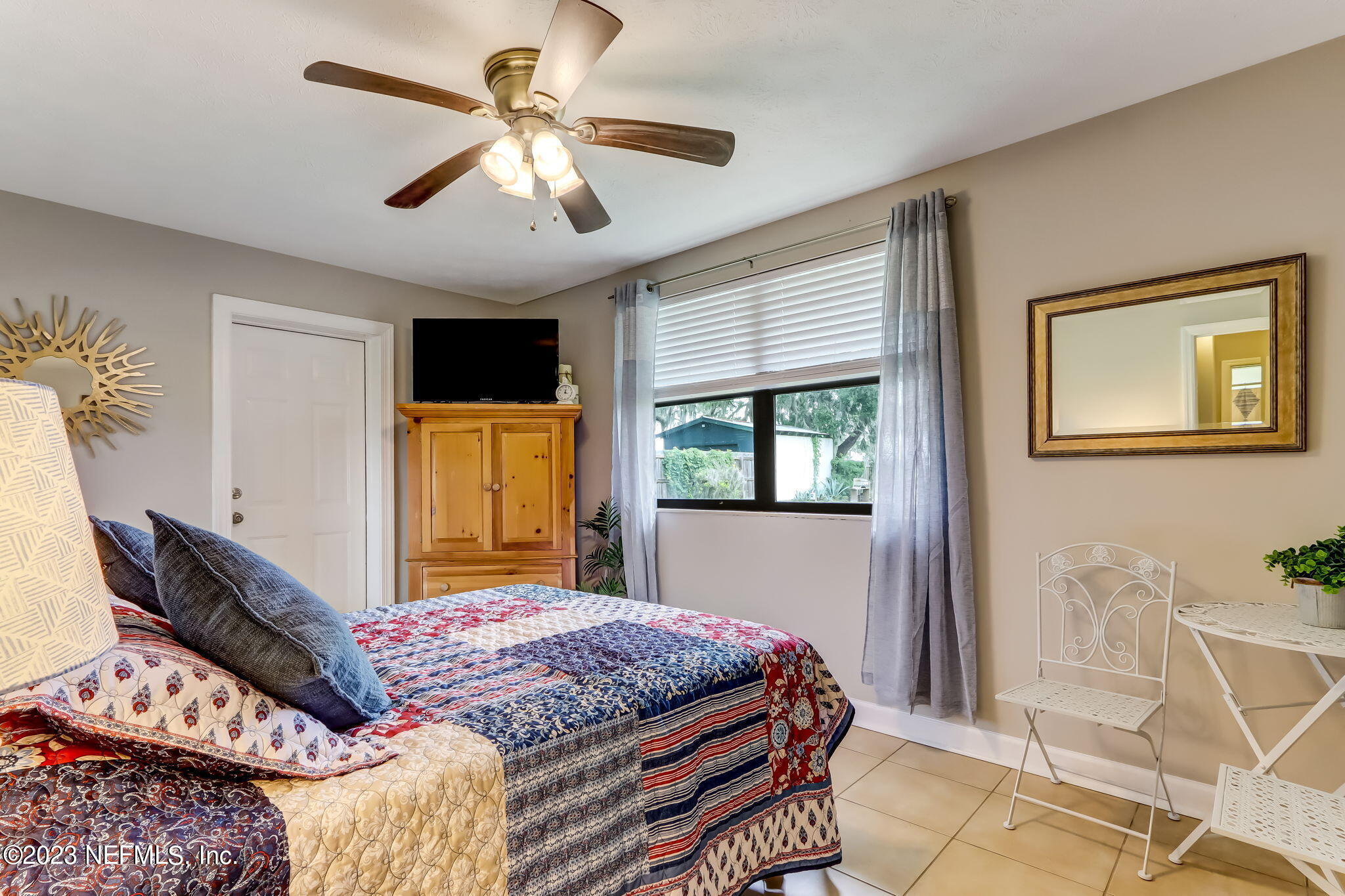 259 Brickyard Road, Unit B Middleburg, FL 32068 - Photo 17 of 53 a bedroom with a bed and wooden floor