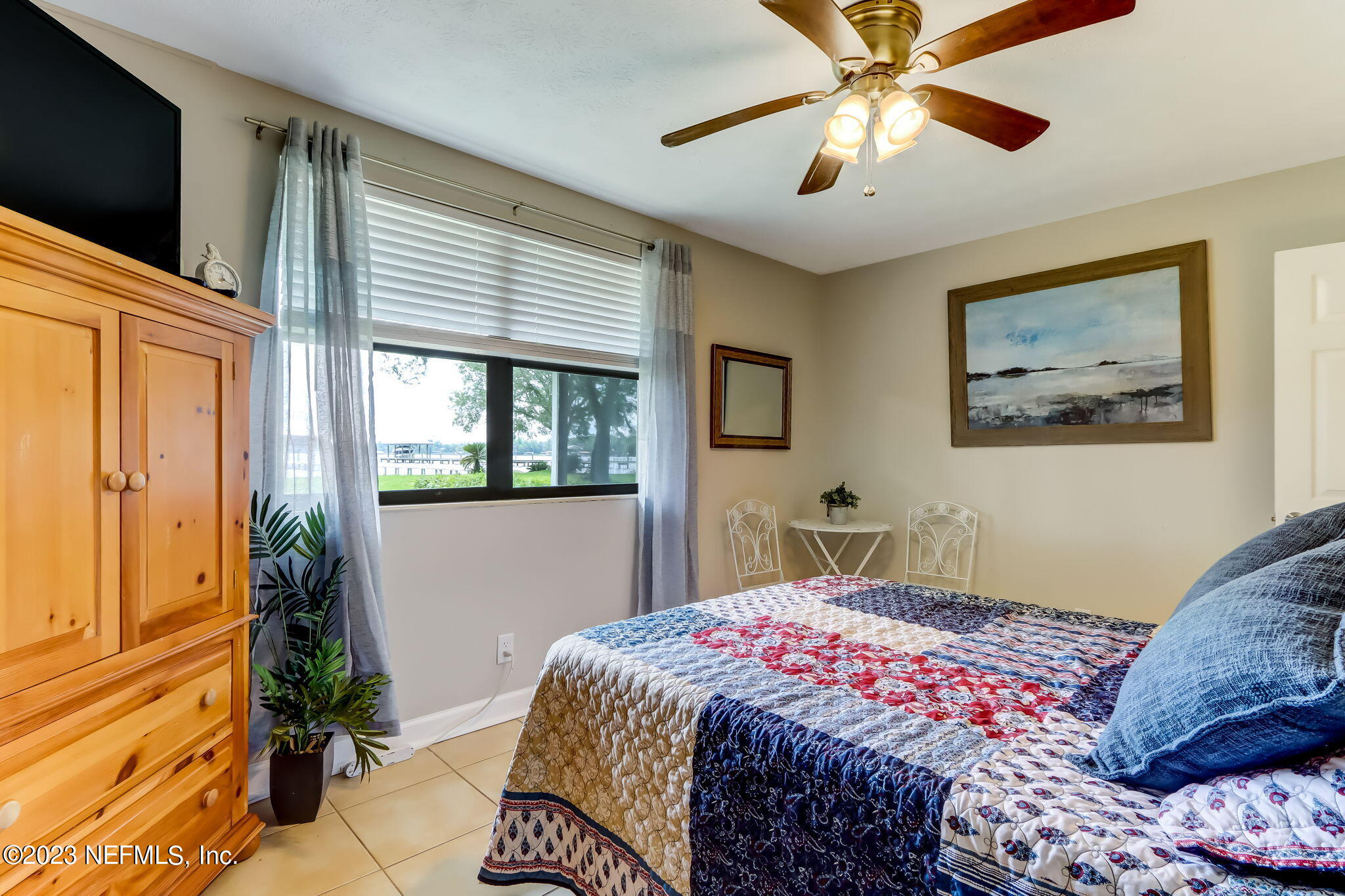 259 Brickyard Road, Unit B Middleburg, FL 32068 - Photo 18 of 53 a bedroom with a bed and a flat screen tv