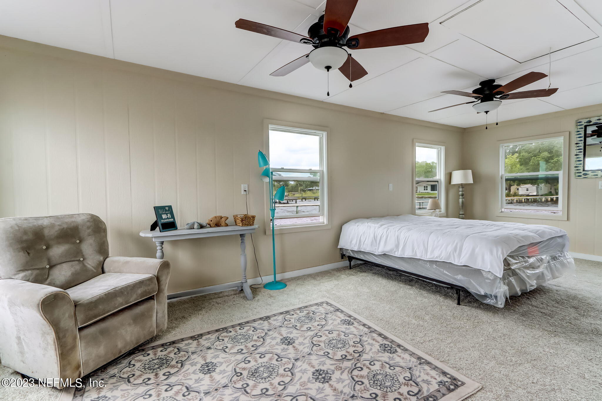 259 Brickyard Road, Unit B Middleburg, FL 32068 - Photo 40 of 53 a bedroom with a bed couch and window