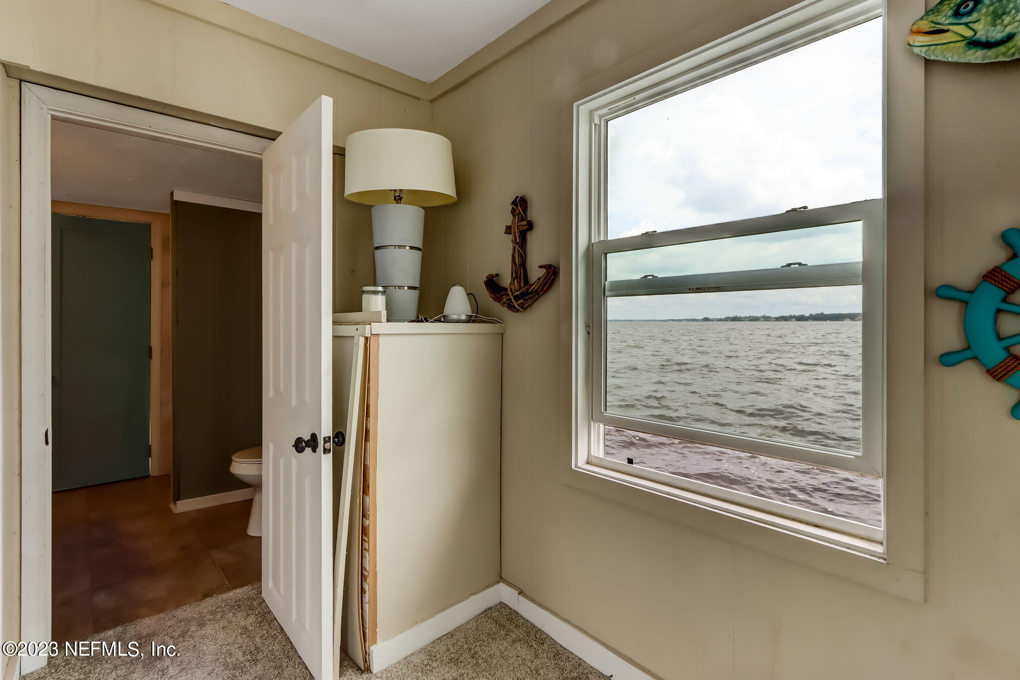 259 Brickyard Road, Unit B Middleburg, FL 32068 - Photo 43 of 53 a view of hallway with furniture and a window