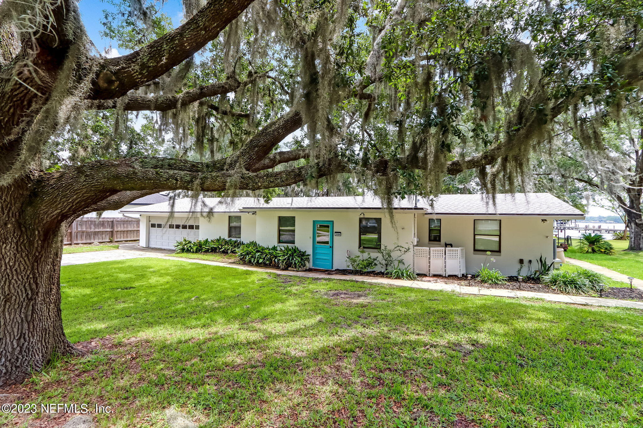 259 Brickyard Road, Unit B Middleburg, FL 32068 - Photo 6 of 53 a view of a house with backyard sitting area and garden