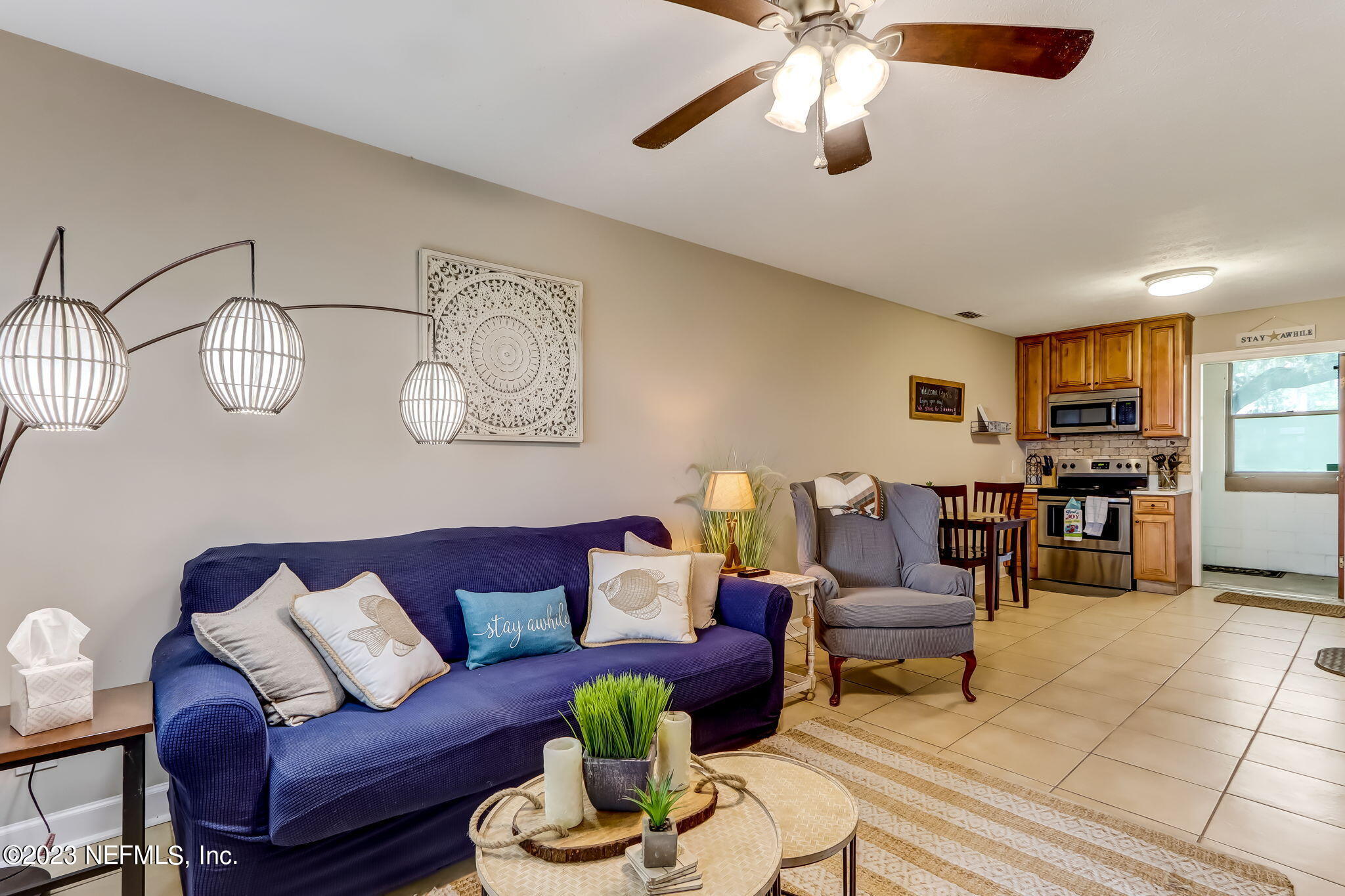 259 Brickyard Road, Unit B Middleburg, FL 32068 - Photo 8 of 53 a living room with furniture kitchen view and a chandelier
