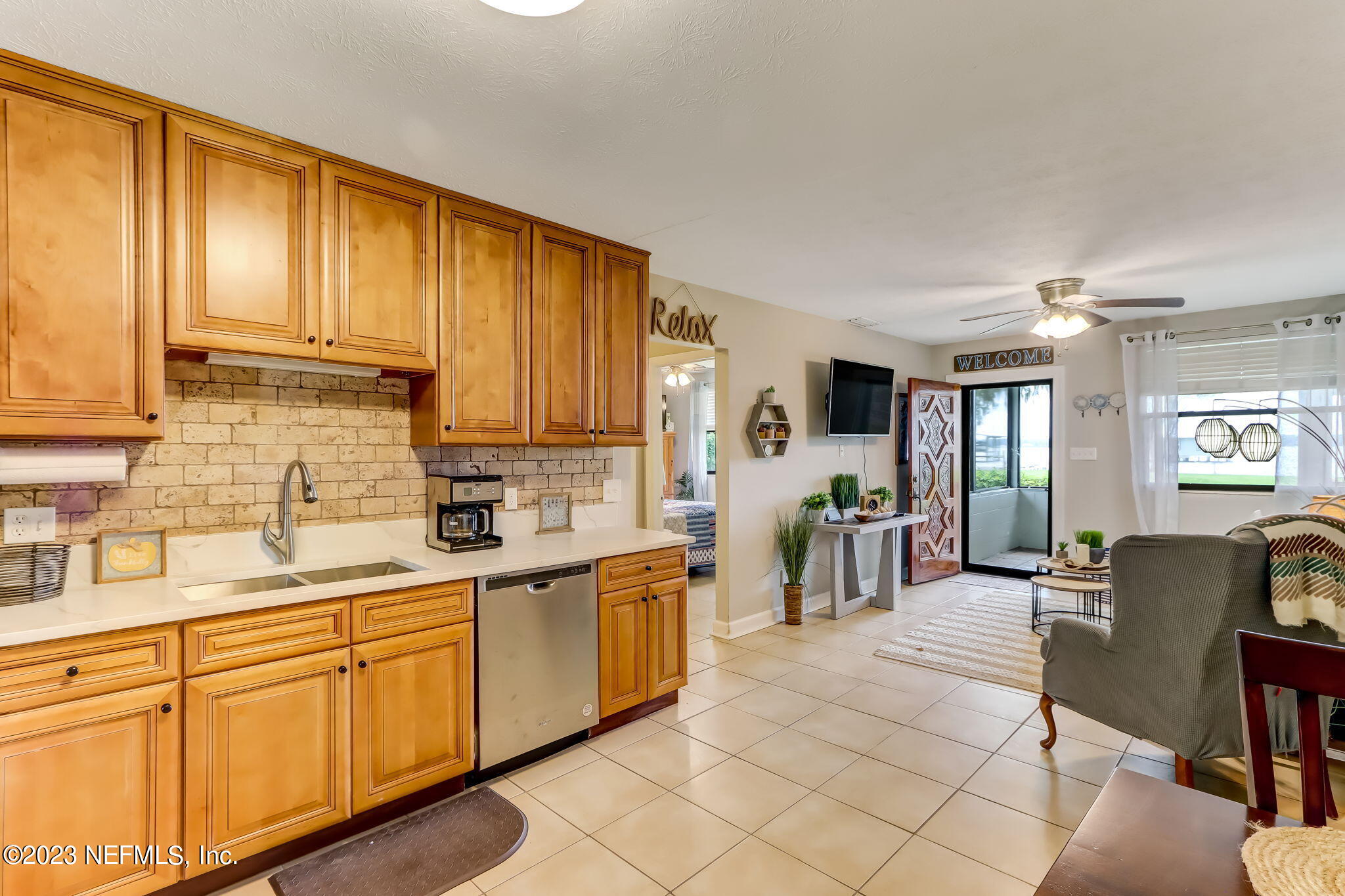 259 Brickyard Road, Unit B Middleburg, FL 32068 - Photo 10 of 53 a kitchen with cabinets a sink and appliances