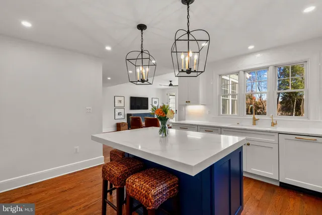 a stove top oven sitting inside of a kitchen