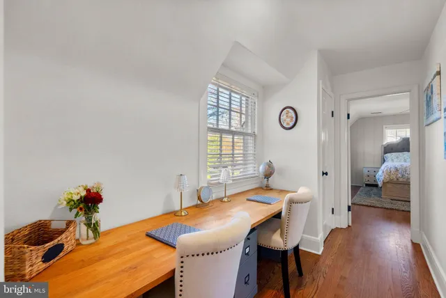 a white bath tub sitting next to a shower