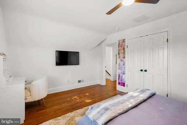 a living room with furniture and kitchen