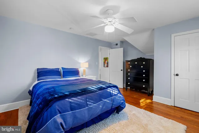 a bedroom with a bed and a table in it