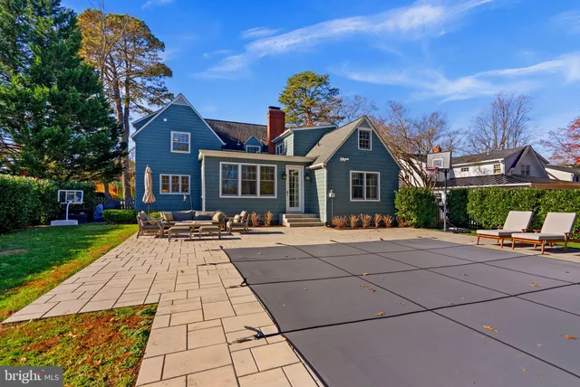 a view of swimming pool with a table and chairs