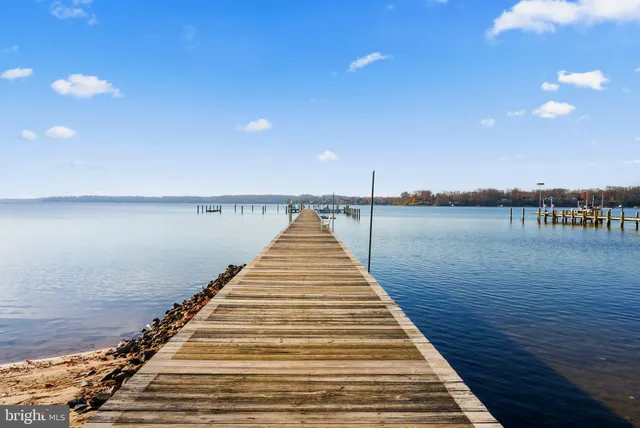 an aerial view of a house with a yard basket ball court and outdoor seating