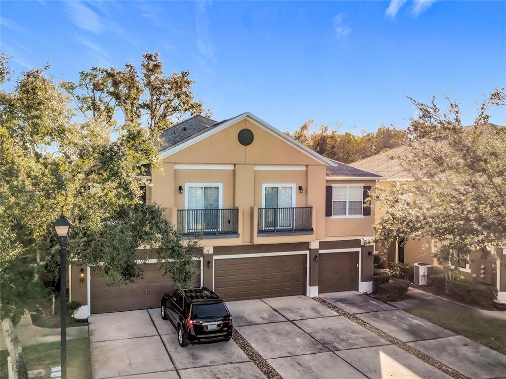 1500 Broken Oak Drive, Unit 25B Winter Garden, FL 34787 - Photo 11 of 62 a front view of a house with a yard