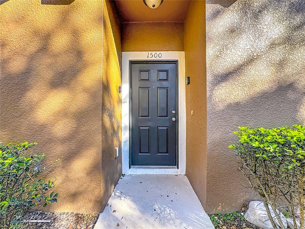 1500 Broken Oak Drive, Unit 25B Winter Garden, FL 34787 - Photo 14 of 62 a front view of a house with a yard