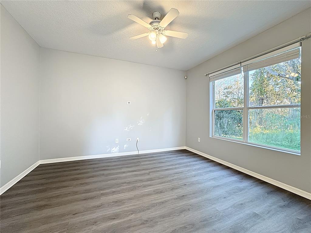 1500 Broken Oak Drive, Unit 25B Winter Garden, FL 34787 - Photo 20 of 62 an empty room with wooden floor and windows