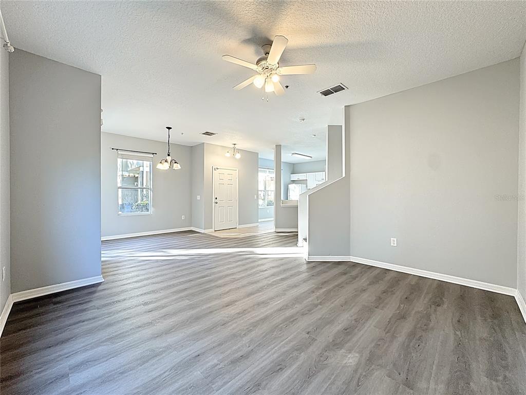 1500 Broken Oak Drive, Unit 25B Winter Garden, FL 34787 - Photo 22 of 62 wooden floor in an empty room with a window