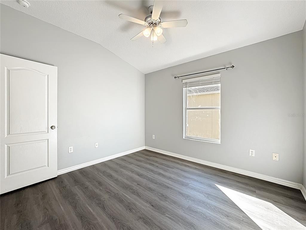 1500 Broken Oak Drive, Unit 25B Winter Garden, FL 34787 - Photo 39 of 62 an empty room with wooden floor closet and windows
