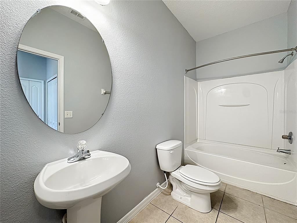 1500 Broken Oak Drive, Unit 25B Winter Garden, FL 34787 - Photo 40 of 62 a bathroom with a sink toilet and a mirror