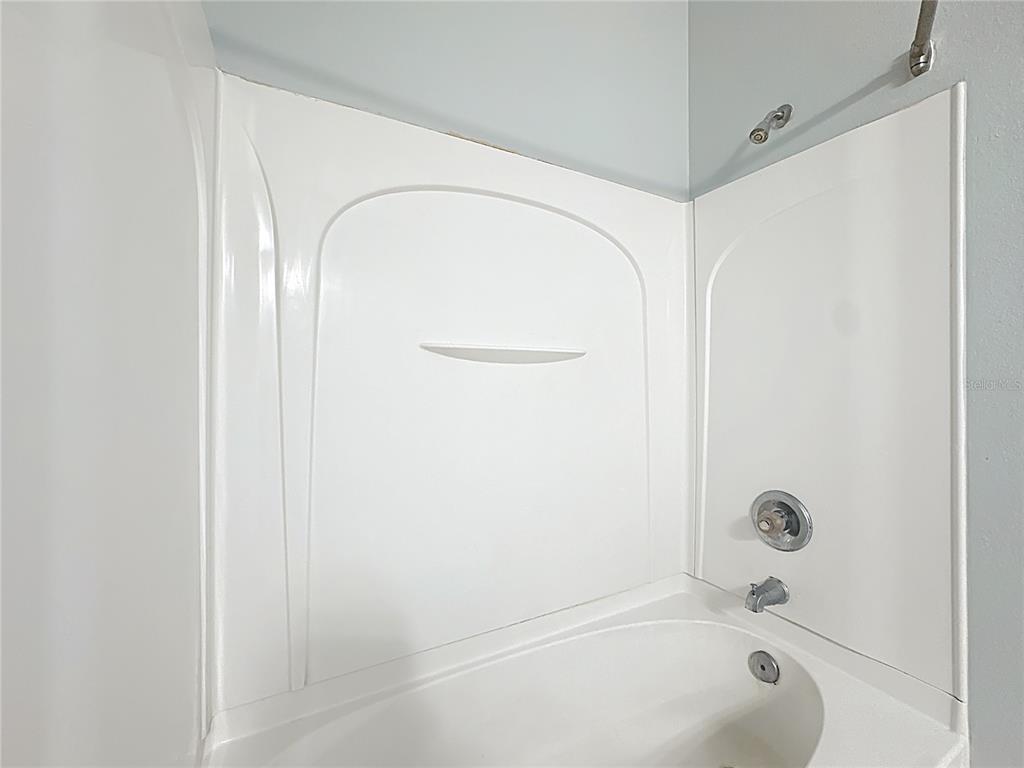 1500 Broken Oak Drive, Unit 25B Winter Garden, FL 34787 - Photo 41 of 62 a bathroom with a tub