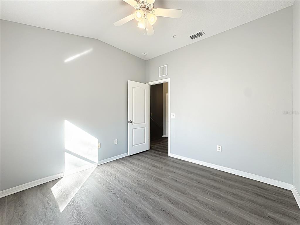 1500 Broken Oak Drive, Unit 25B Winter Garden, FL 34787 - Photo 43 of 62 a view of an empty room with wooden floor
