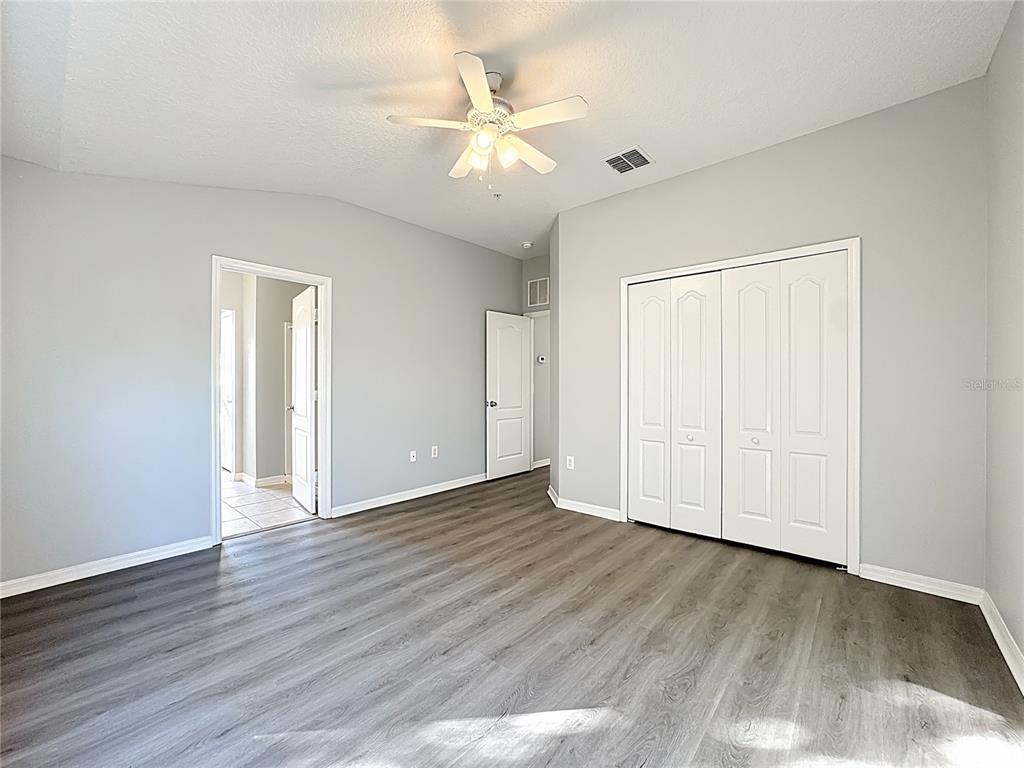 1500 Broken Oak Drive, Unit 25B Winter Garden, FL 34787 - Photo 46 of 62 a view of an empty room with wooden floor