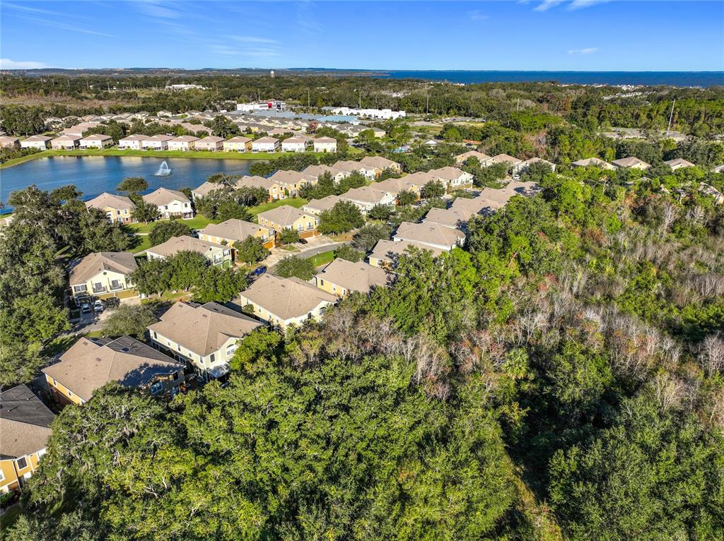 1500 Broken Oak Drive, Unit 25B Winter Garden, FL 34787 - Photo 60 of 62 an aerial view of residential houses with outdoor space and trees