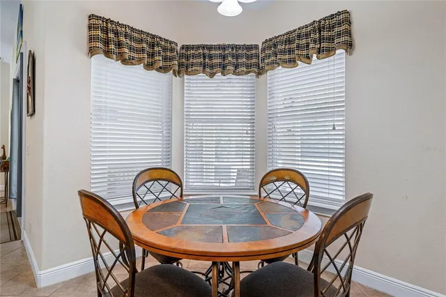 a view of a room with furniture and window