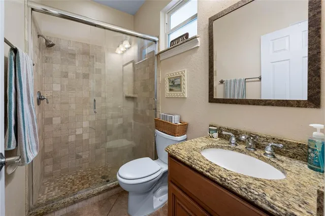 a view of a dining room with furniture large windows and wooden floor
