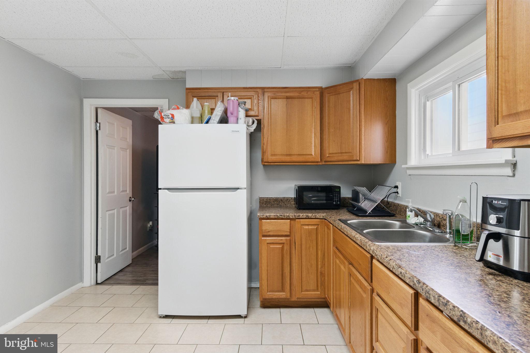 4508 Post Road Marcus Hook, PA 19061 - Photo 12 of 38 a kitchen with stainless steel appliances granite countertop a refrigerator sink and cabinets